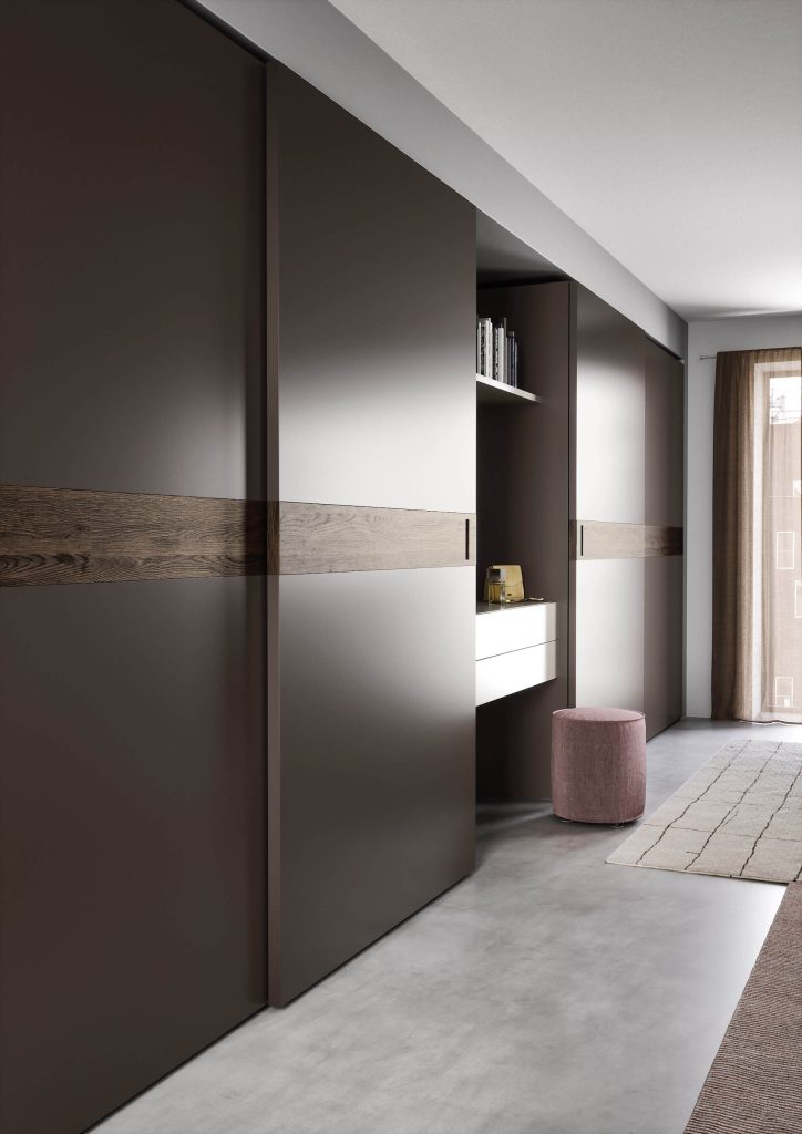 Elegant sliding door wardrobe brown lacquer inlaid wood detail handle modern Italian fitted bedroom furniture Dublin Ireland