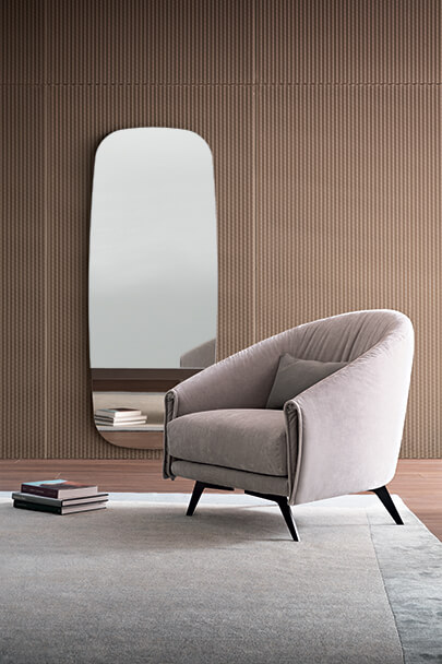 Bonaldo Saddle tub Armchair metal legs with curved back upholstered seat and Modern furniture Dublin Ireland