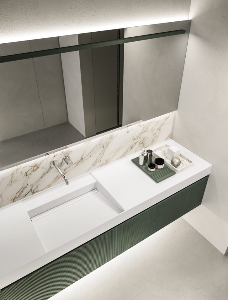 Sage green ribbed front bathroom vanity unit with monolith stone sink and top with LED lit mirror custom bespoke