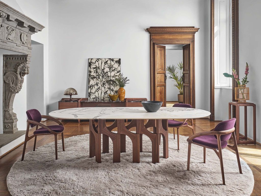 Porada Augusto dining table. Marble top with solid wood organic shaped base. Best cool dining table design Dublin Ireland